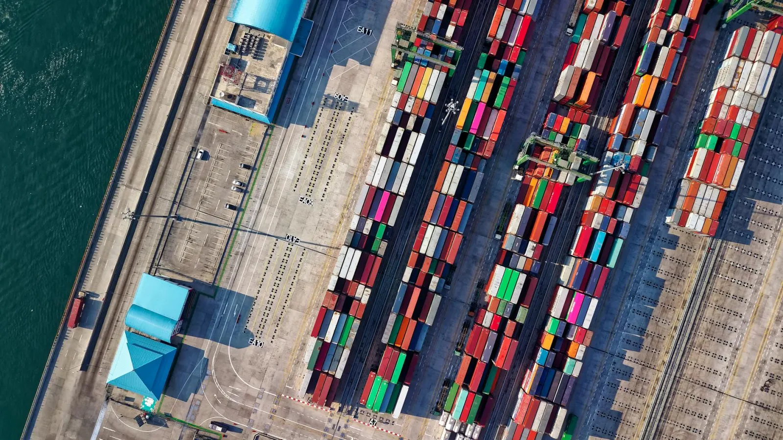 Aerial view of rows of colorful shipping containers